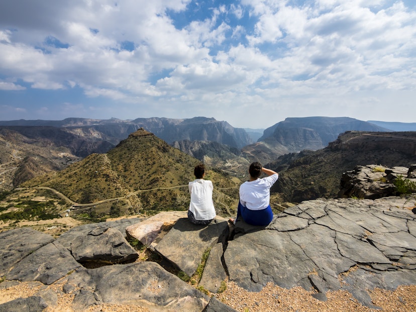 Oman, Jabal Akhdar, Two women looking at mountain view