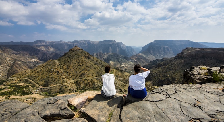 Oman, Jabal Akhdar, Two women looking at mountain view