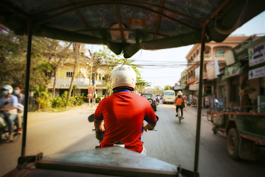A view from the back seat of a tuk-tuk, Siem Reap, Cambodia