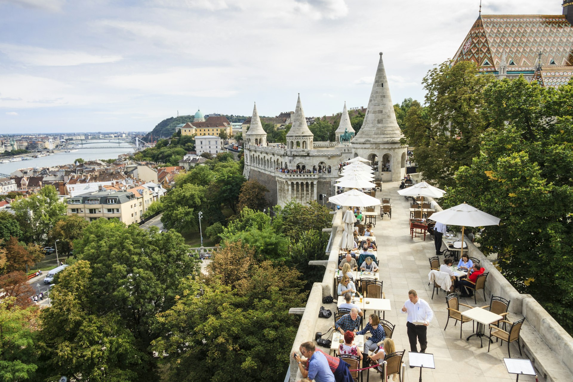 Outdoor restaurant terrace with views across the city of Budapest and down to the river