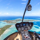 Tropical island seen from helicopter cockpit, Malolo island, Fiji