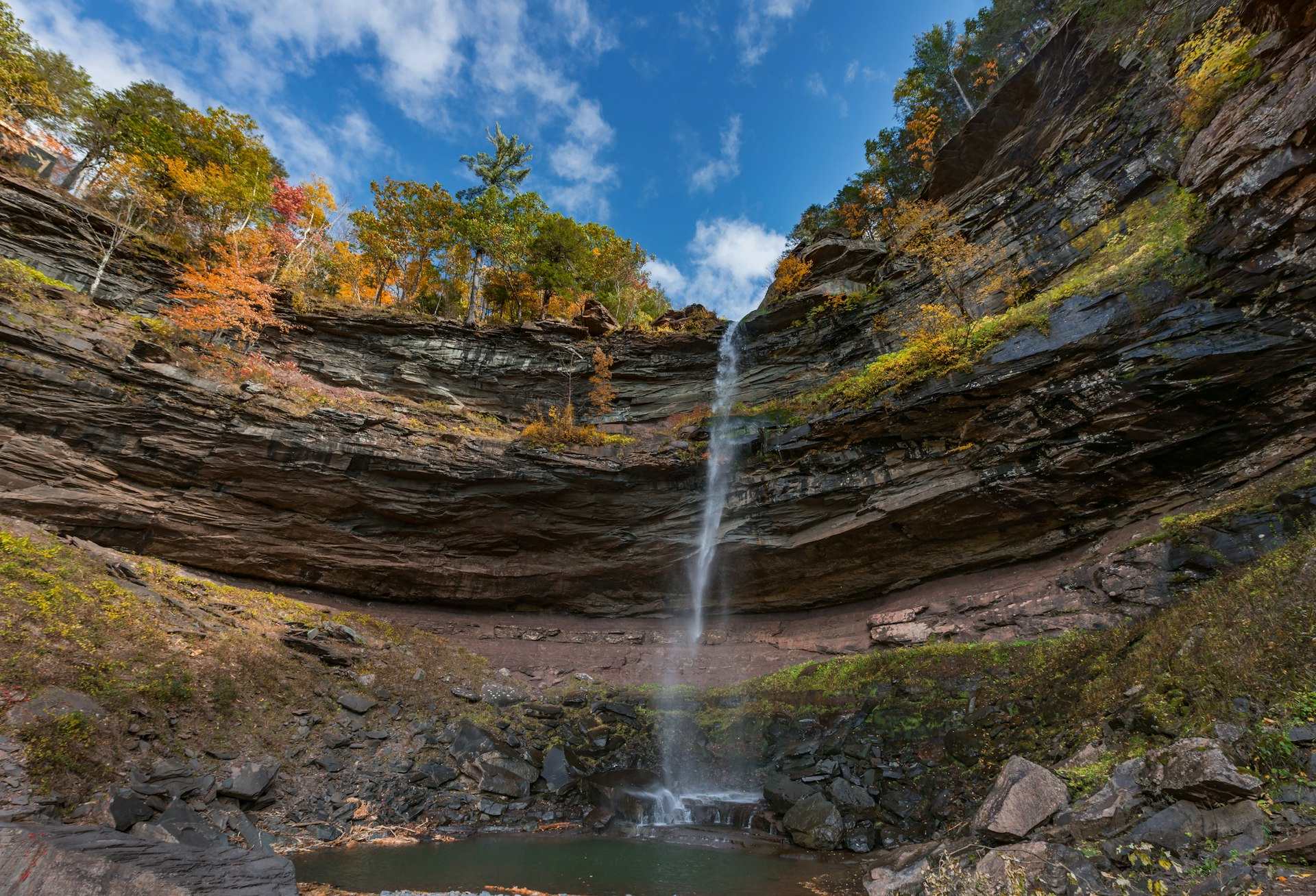Kaaterskill Falls amid a fall backdrop in New York's Catskills