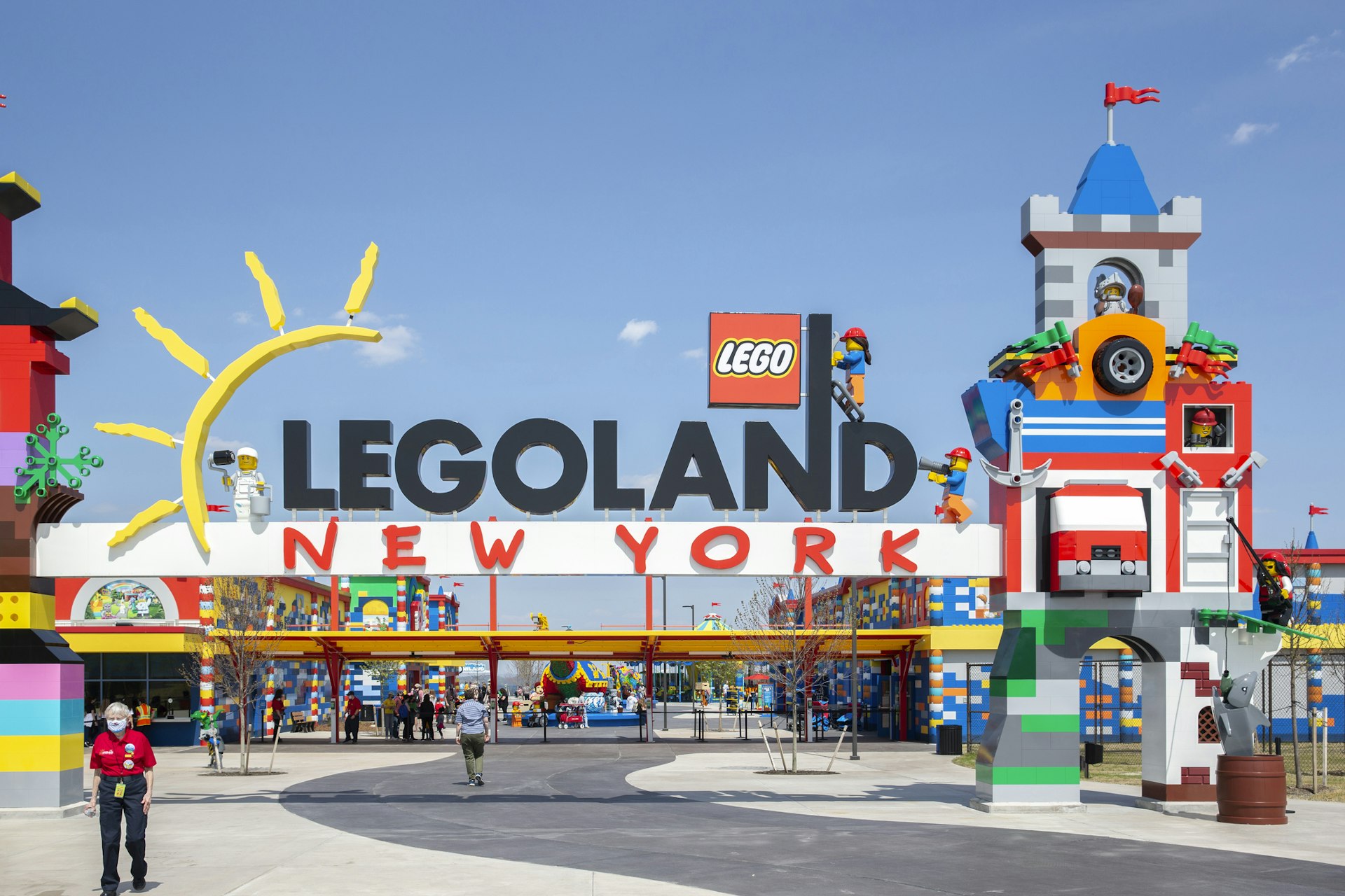 Visitors pass through the colorful entrance gate to Legoland in New York