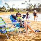 Woman relaxing on beach in Kauai.