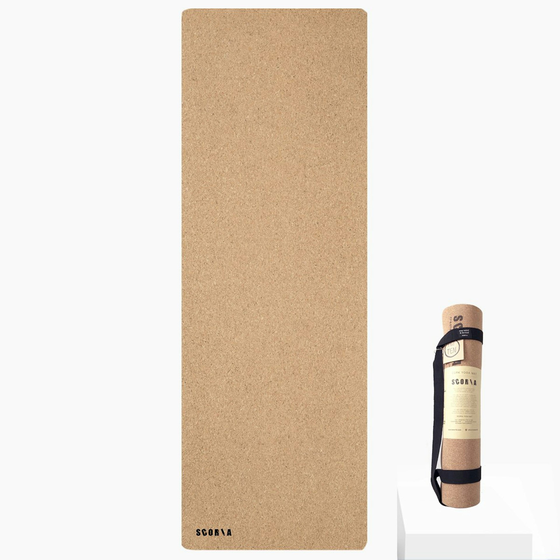 A brown cork yoga mat, seen both unrolled and rolled up 