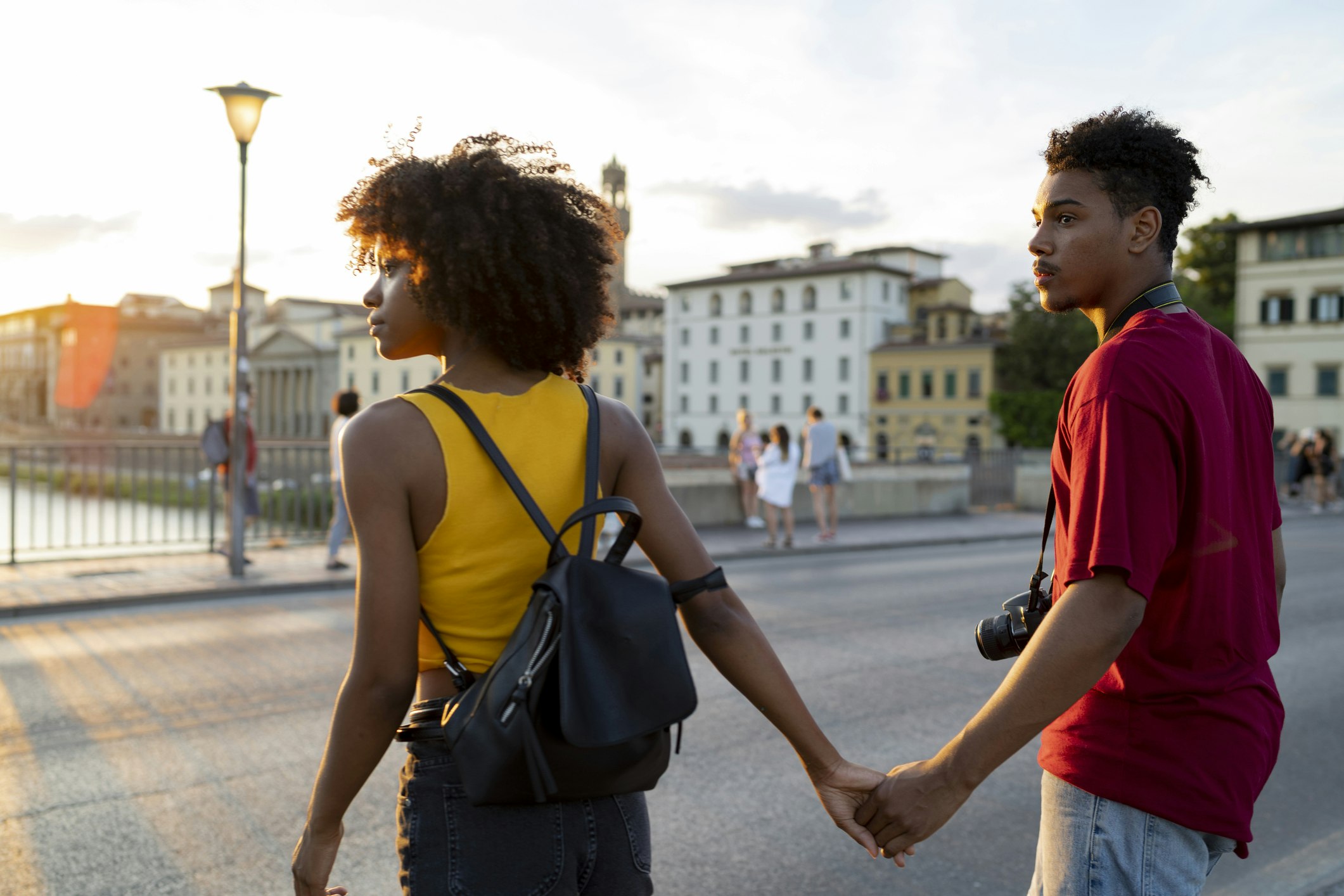 Young tourist couple exploring the city at sunset, Florence, Italy