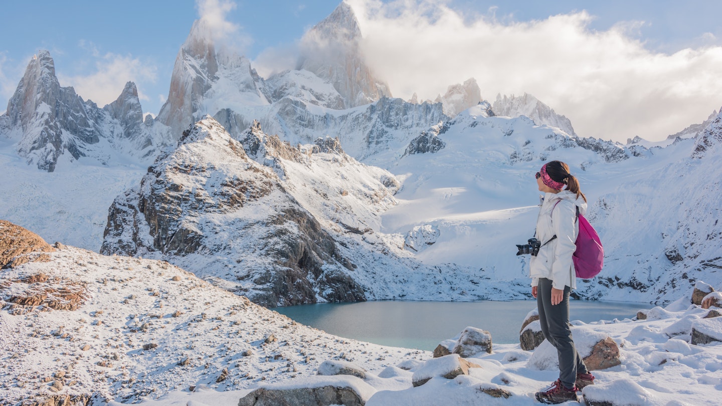Young Asian woman looking at Mount Fitz Roy, Argentina