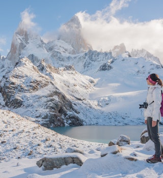 Young Asian woman looking at Mount Fitz Roy, Argentina