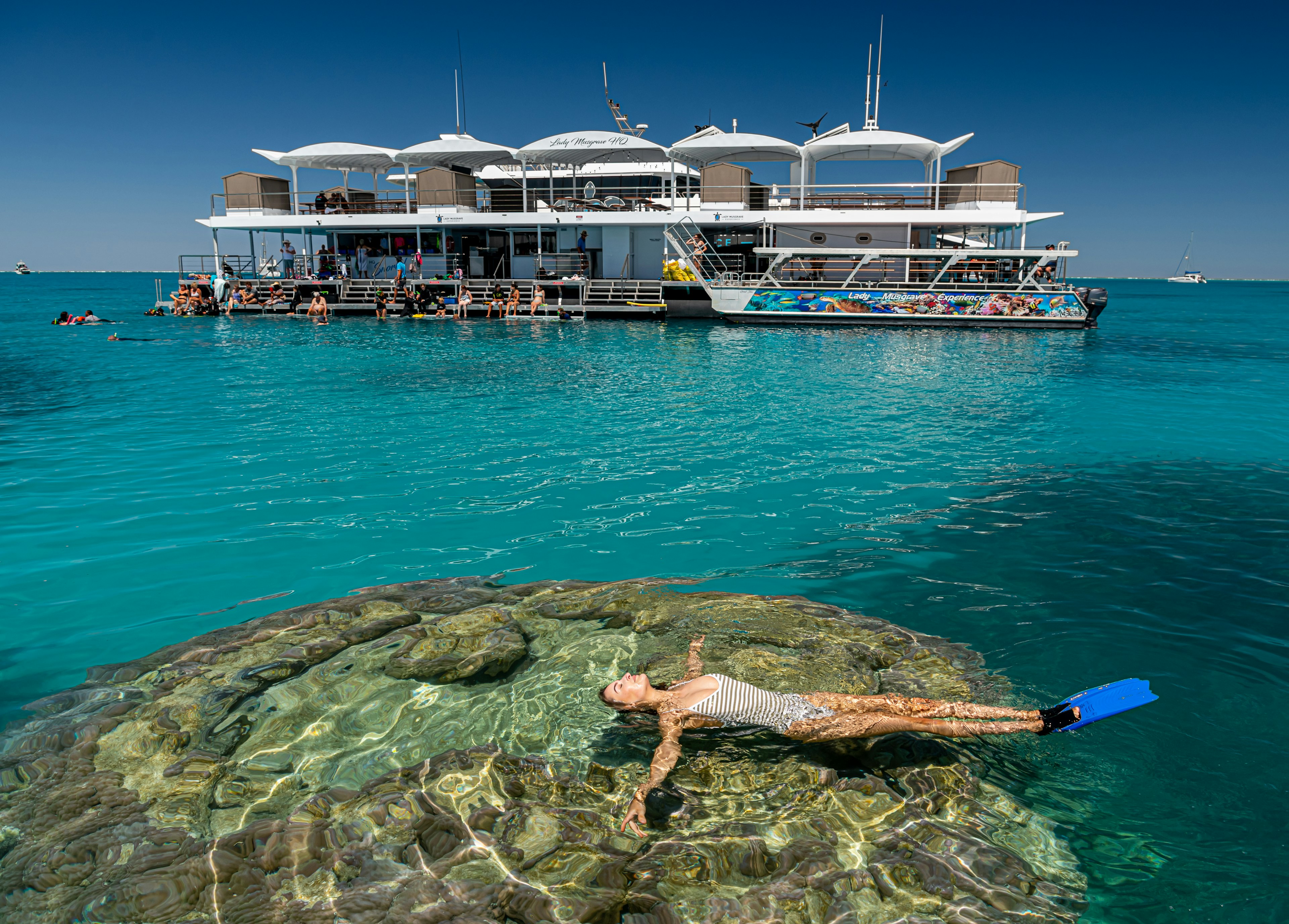 Lady Musgrave Island, Kate Bray from Bundaberg enjoying the Lady Musgrave HQ pontoon, where you can sleep on the reef