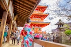 A woman wearing traditional Japanese clothing at Kiyomizu-dera Buddhist Temple.