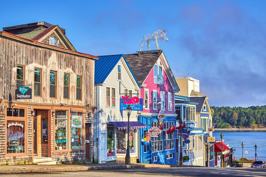 Colorful wooden store fronts with lobster signs in Bar Harbor, Maine