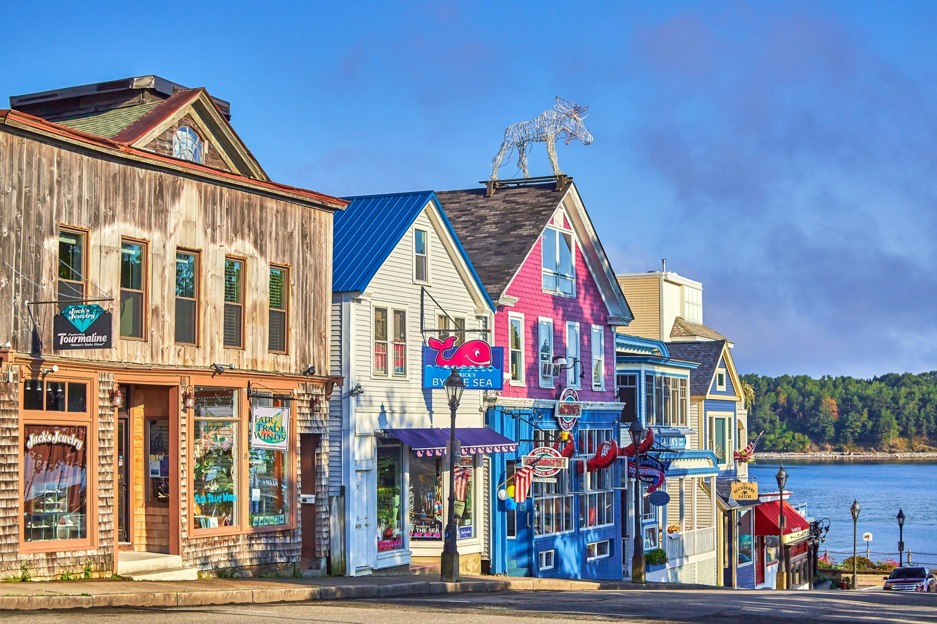 Colorful wooden store fronts with lobster signs in Bar Harbor, Maine