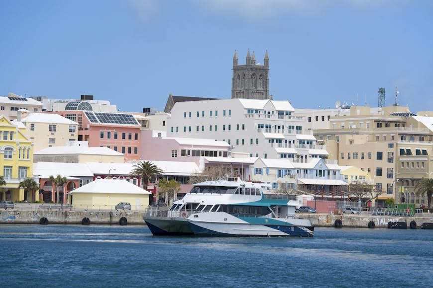 A Bermuda ferry cruising past the downtown waterfront of Hamilton, Bermuda