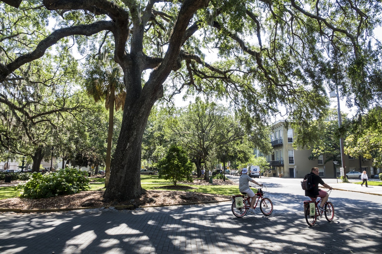 Georgia, Savannah, historic district, Lafayette Square, bicycle, riders. (Photo by: Jeffrey Greenberg/Universal Images Group via Getty Images)