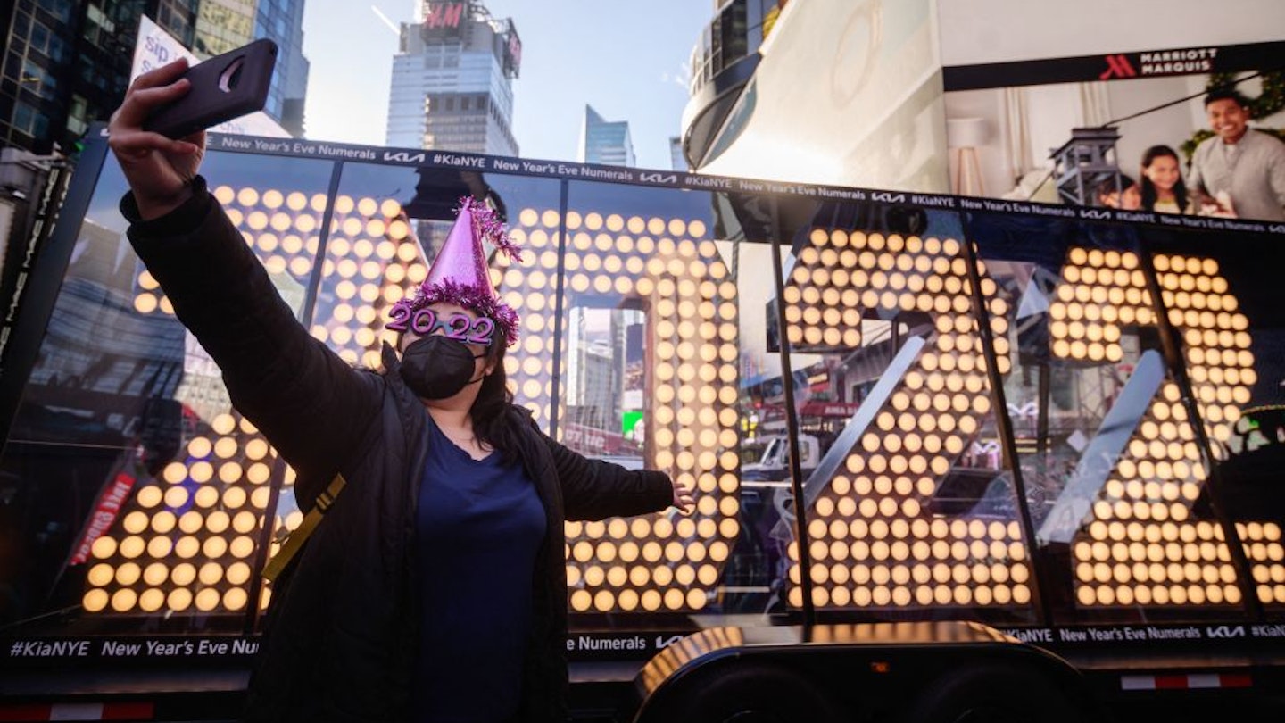 Teresa Hui poses for photos before the 2022 numerals to be used at a new year countdown event in Times Square in New York, on December 20, 2021. -  (Photo by Ed JONES / AFP) (Photo by ED JONES/AFP via Getty Images)