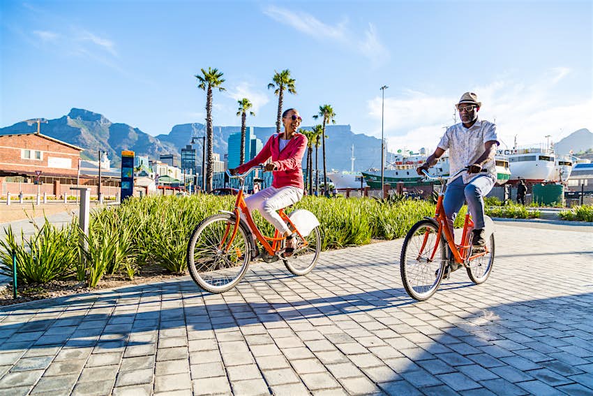 Couple sightseeing on rental bikes in Cape Town