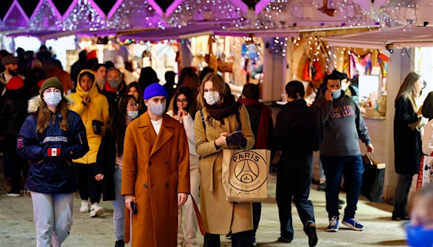 PARIS, FRANCE - NOVEMBER 29: Visitors wearing protective face masks visit the Christmas market in Tuileries Garden during the coronavirus epidemic (COVID-19) on November 29, 2021 in Paris France. Following the announcements by the Minister of Health, Oliv
