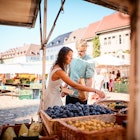 Couple shopping at an open-air market in Freiburg, Germany