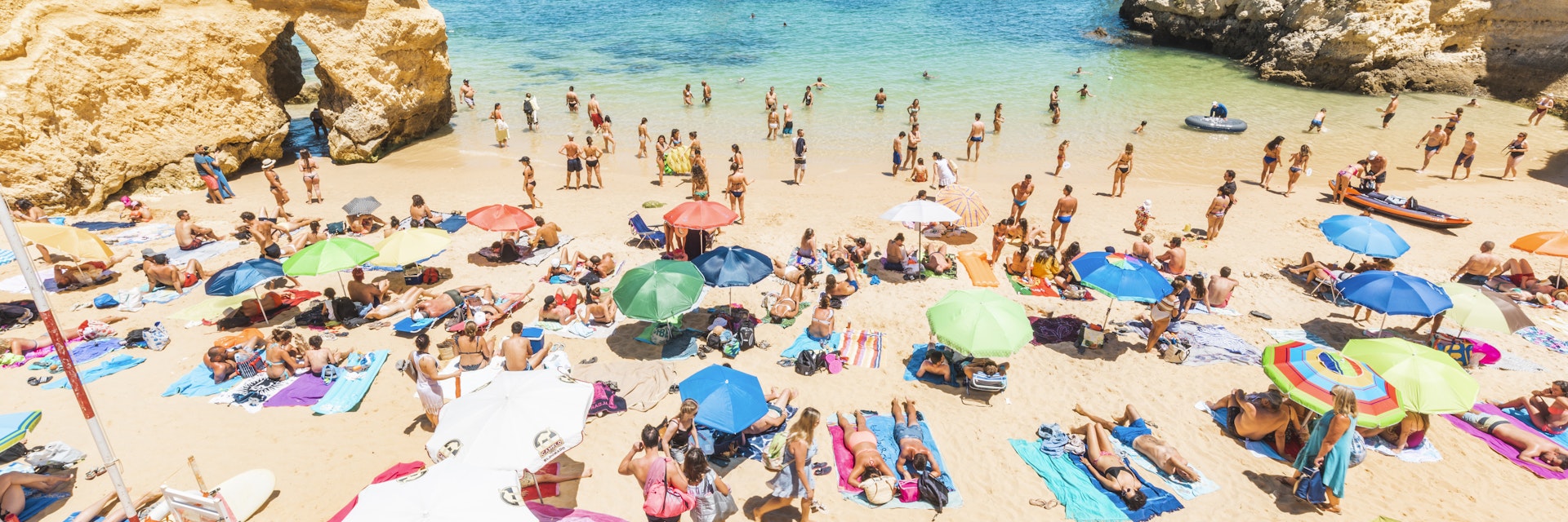 Tourists sunbathing in Praia do Camilo, Lagos, Faro district, Algarve, Portugal