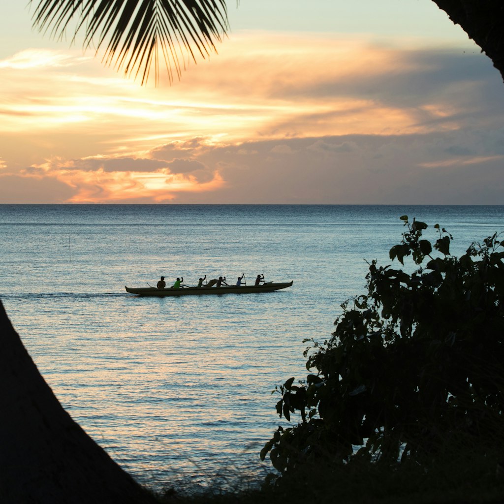 A south Maui beach, Kihei, is home to outrigger canoes and palm trees