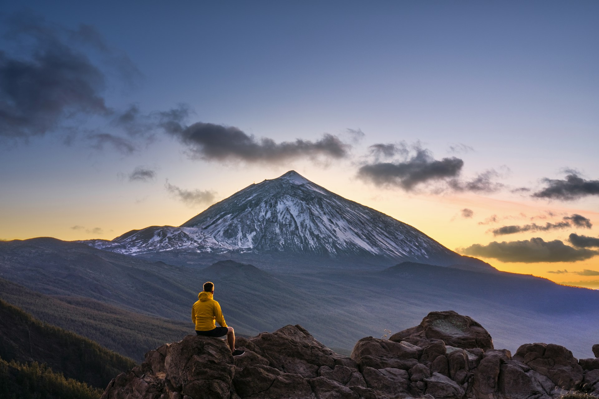Man admiring the view of volcano Teide at dusk. Tenerife, Canary Islands, Spain