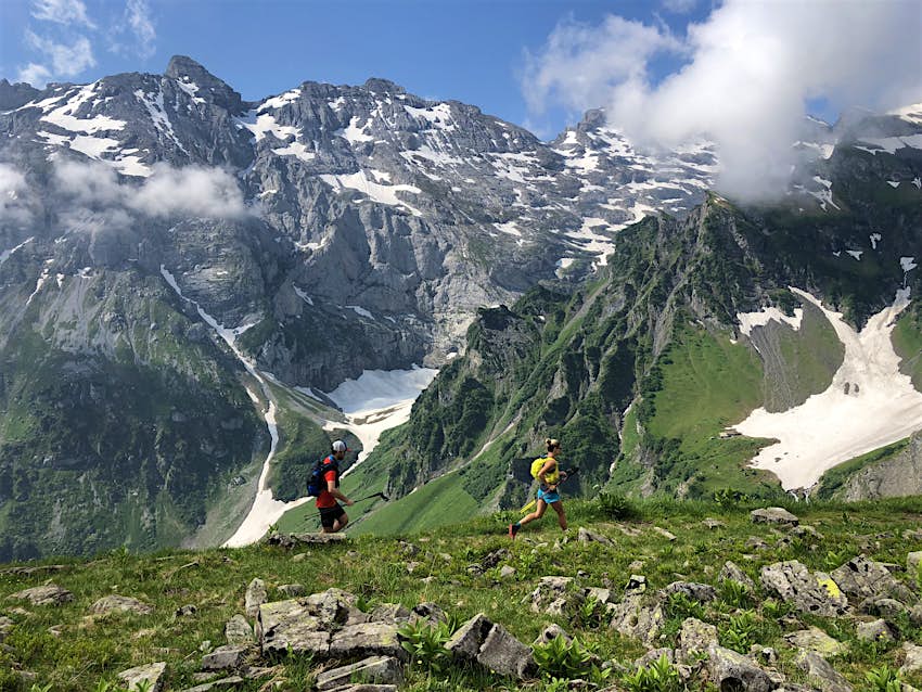 Hikers follow the hiking trail Via Alpina, Slovenia