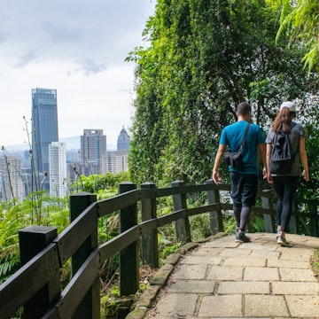 Couple Hiking on Forest Path and Taipei Skyline in Background - Taipei, Taiwan