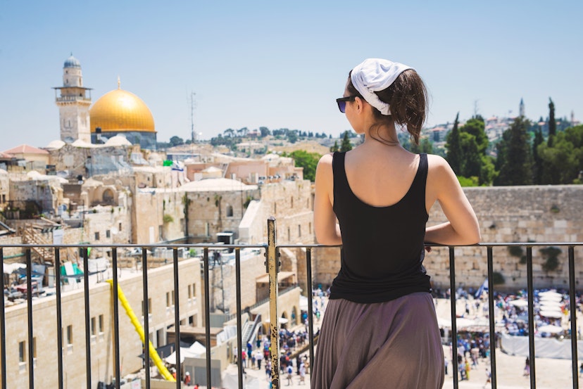 Girl looks at the Wailing Wall in Jerusalem