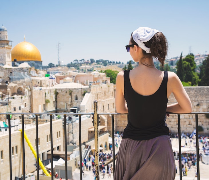 Girl looks at the Wailing Wall in Jerusalem