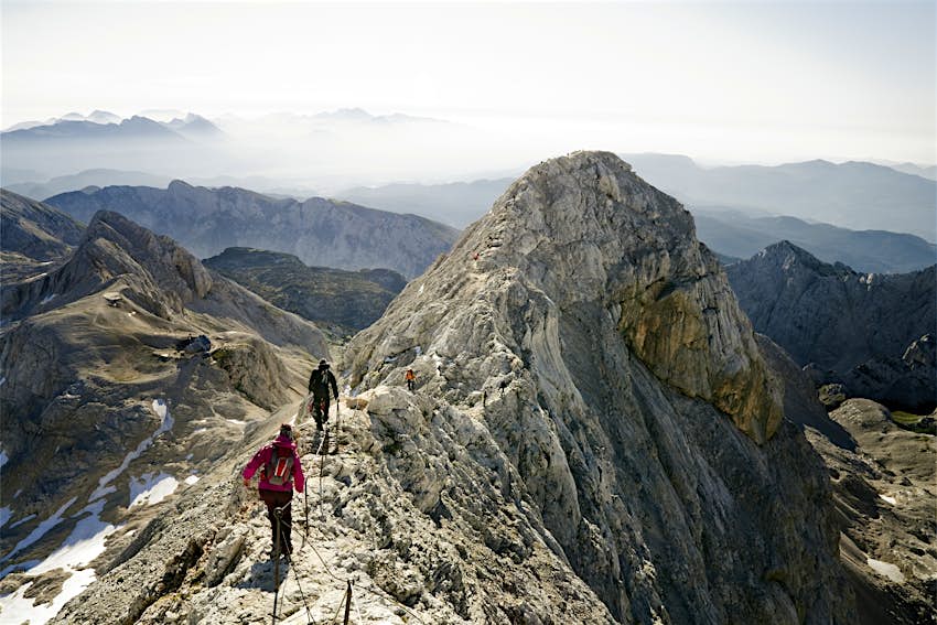 Mountaineers climbing ridge on Triglav mountain, Slovenia