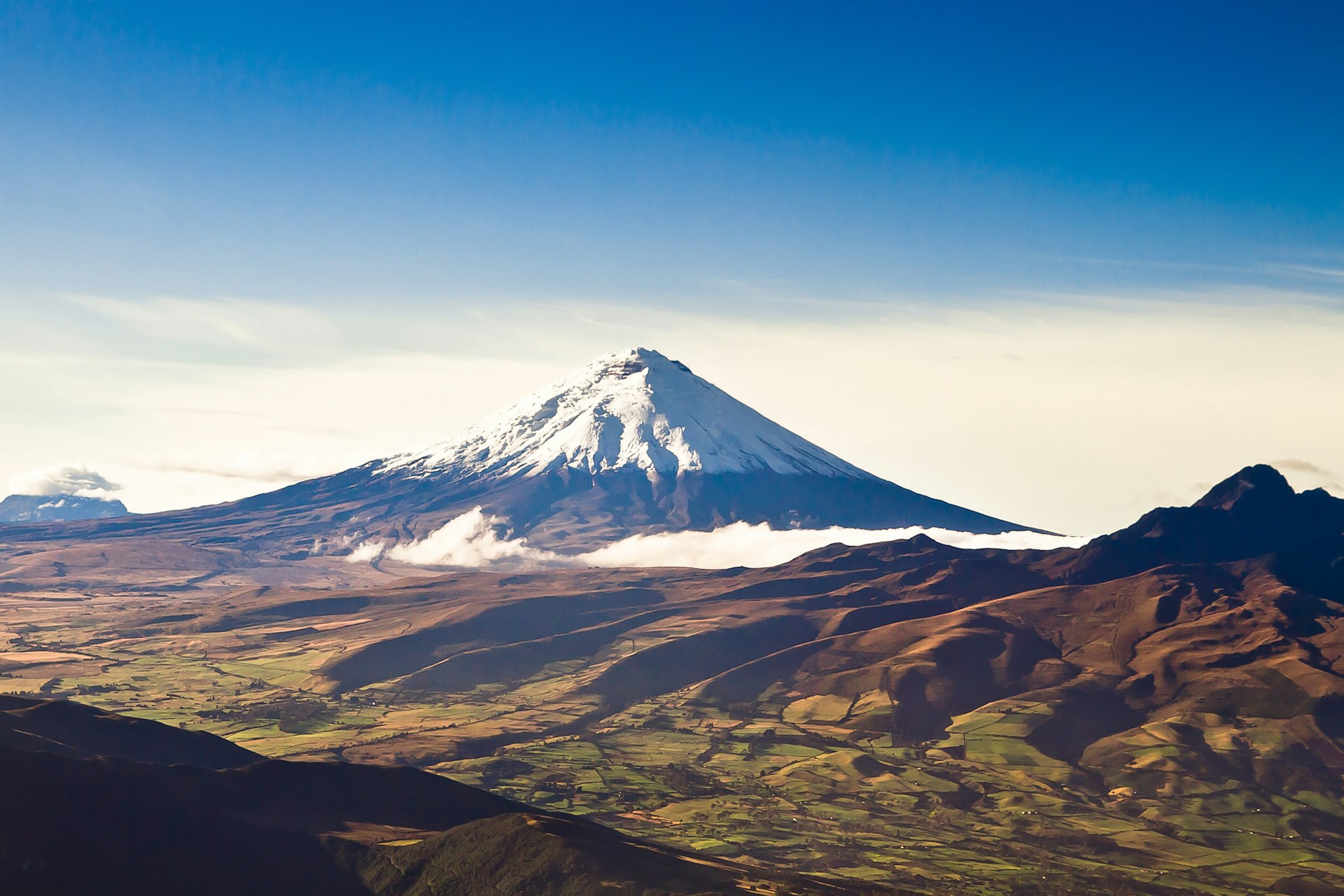 Wide-angle view of the snow-capped Cotopaxi volcano, Ecuador
