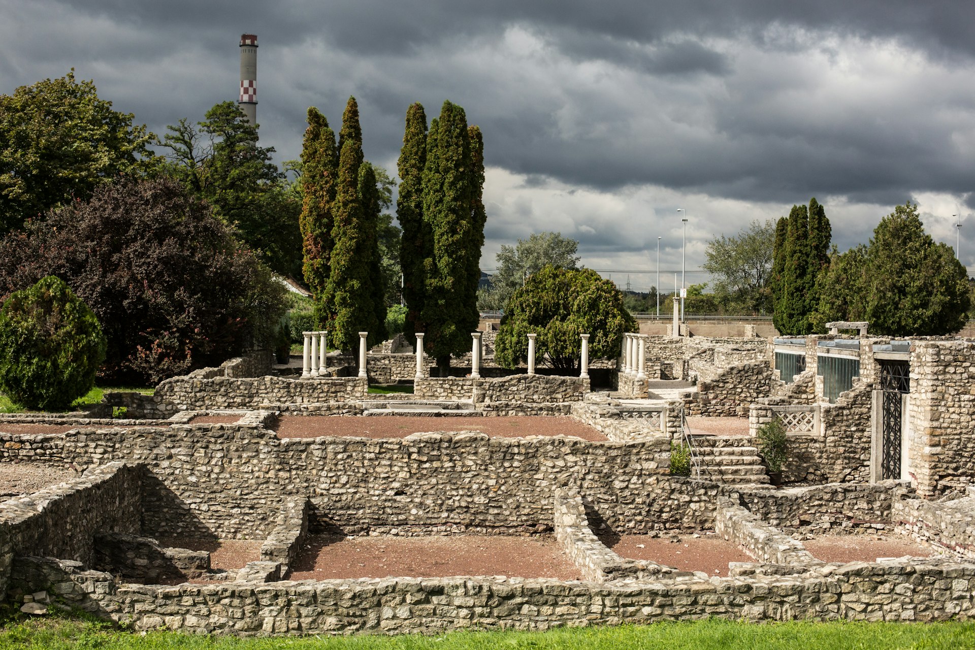 Ruins from the 1st century Roman town of Aquincum in Budapest, photographed under a stormy sky