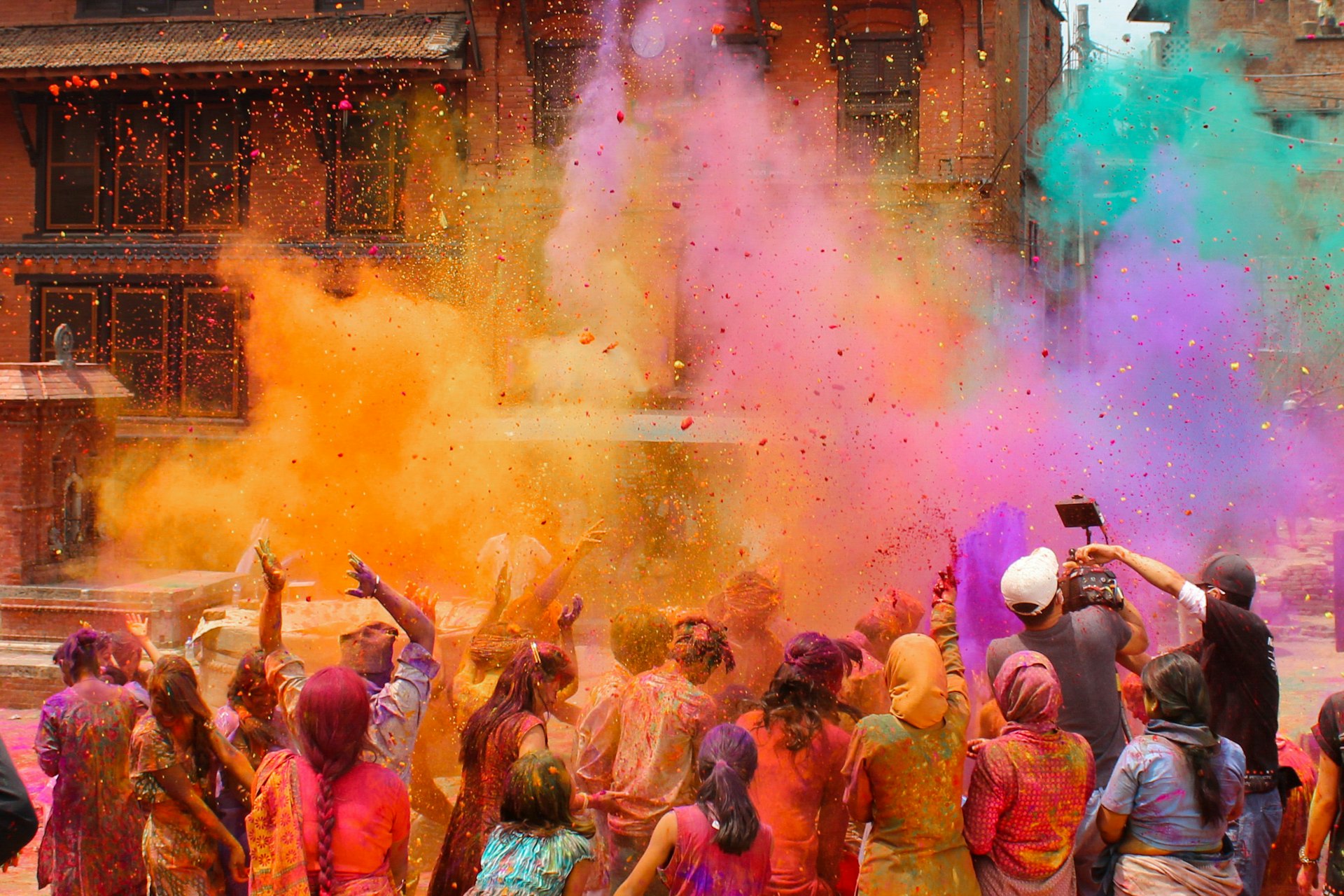 People ceelbrate Holi by throwing colored powder in Bhaktapur