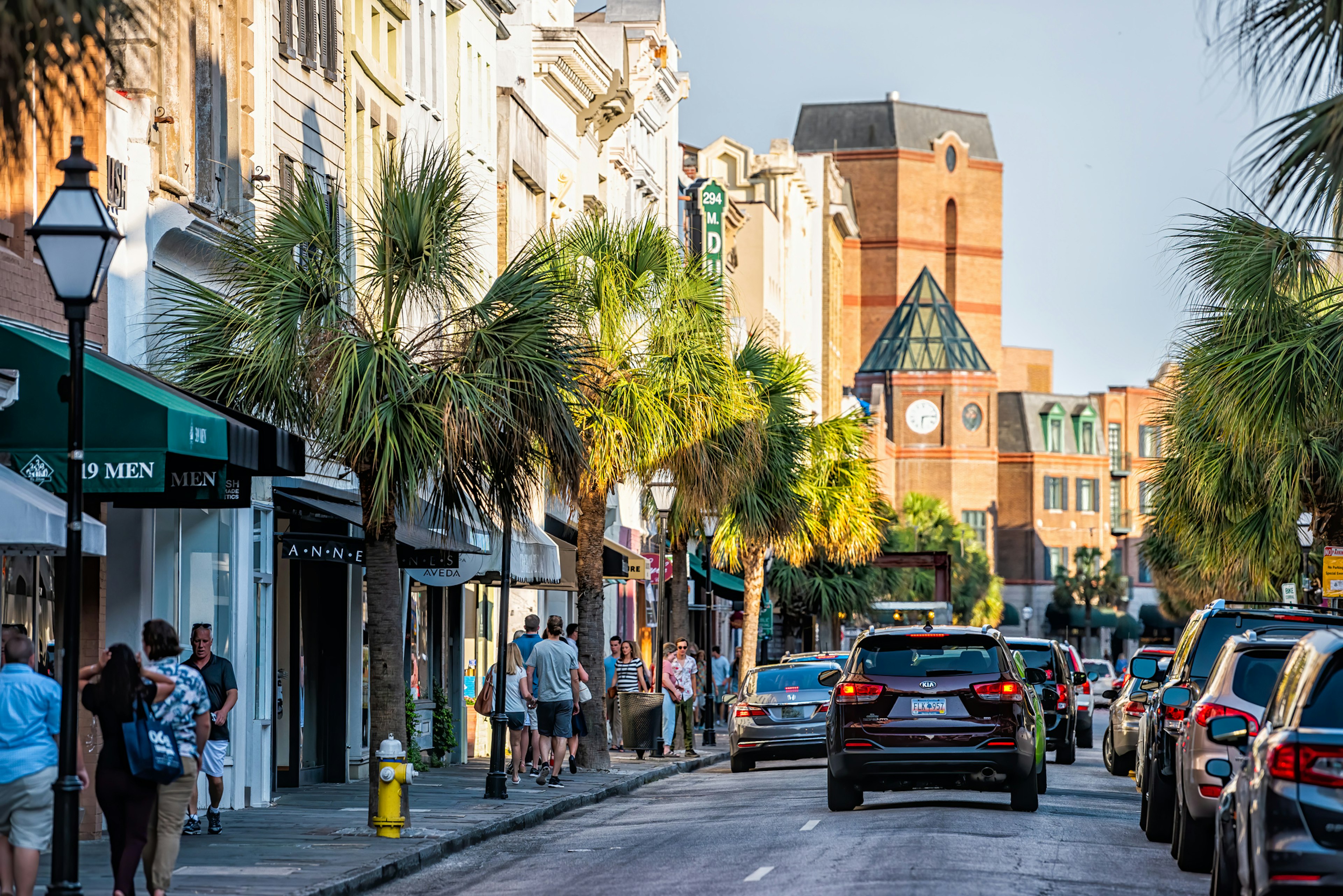 Charleston, USA - May 12, 2018: Downtown district in city with King street in South Carolina with cars and people in southern town shopping and view of Belmond Place hotel