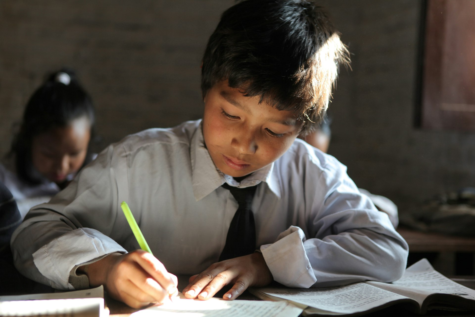 Primary students study Nepali in a small classroom in Kathmandu, Nepal