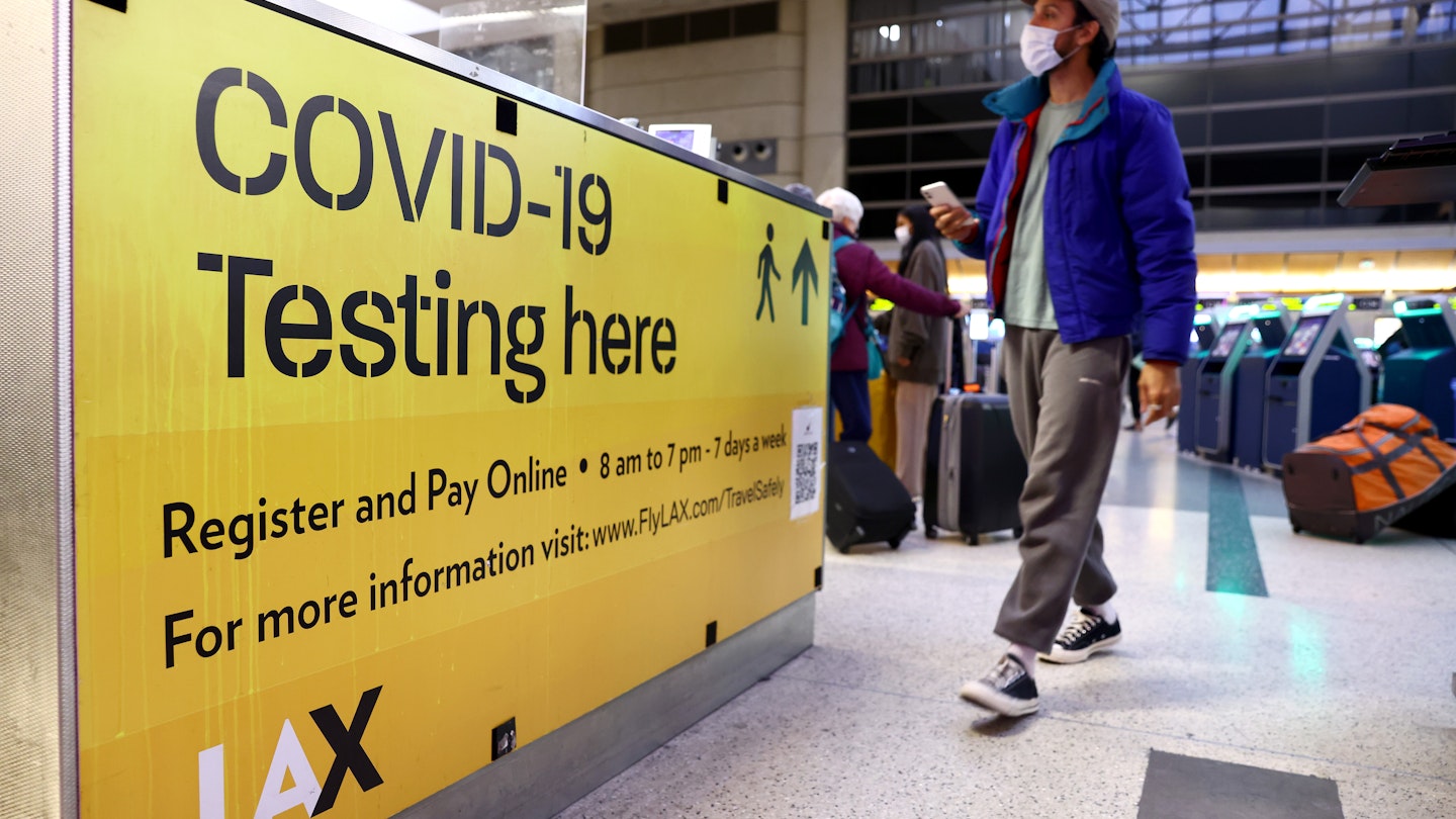 LOS ANGELES, CALIFORNIA - DECEMBER 01: A COVID-19 test center operates inside the Tom Bradley International Terminal at Los Angeles International Airport (LAX) on December 01, 2021 in Los Angeles, California. The Biden administration is planning to announce tighter restrictions for travelers flying into the United States, including requiring a negative test for COVID-19 one day ahead of travel, in response to the new Omicron variant. (Photo by Mario Tama/Getty Images)