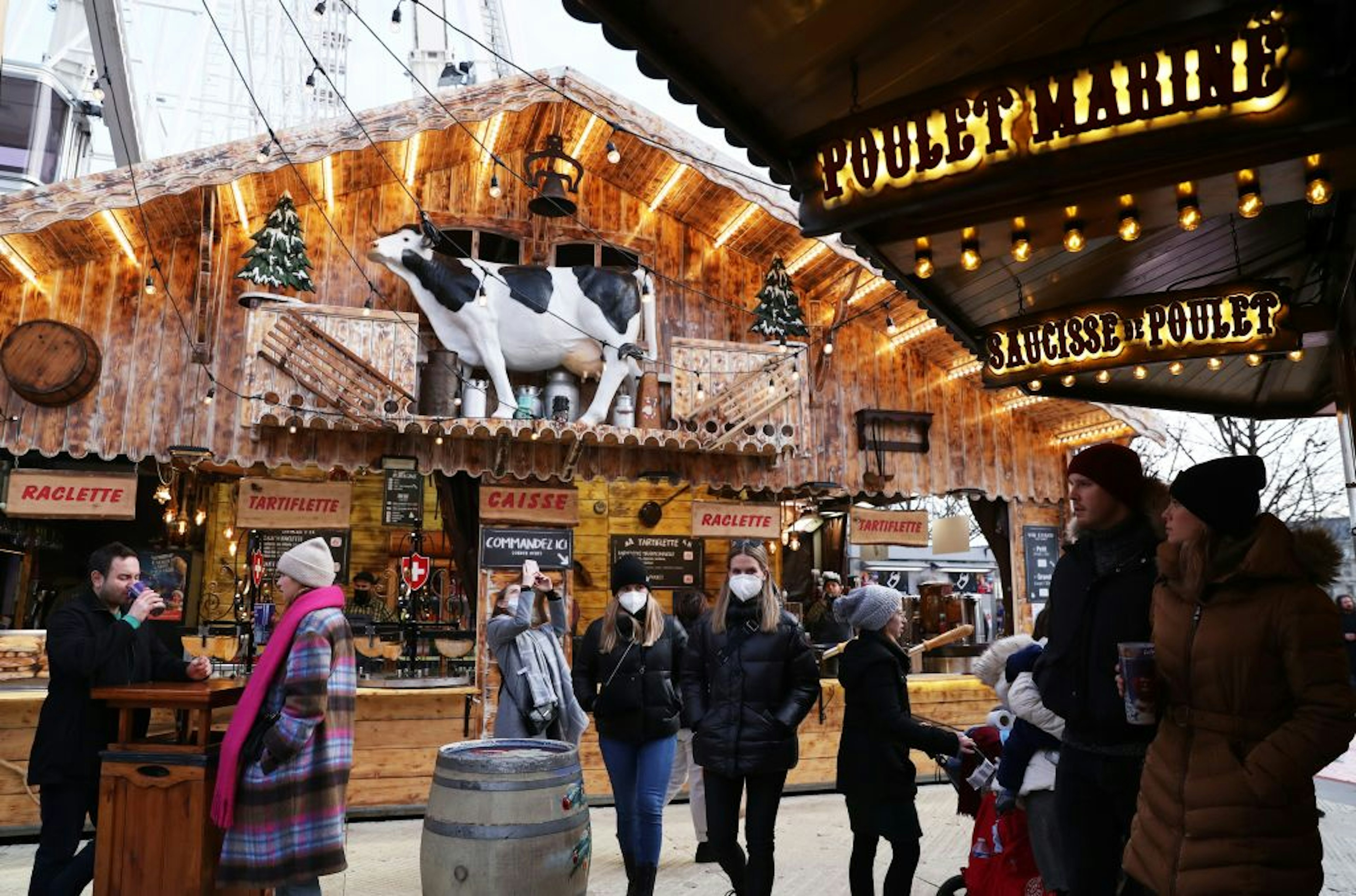 People enjoy themselves at the Christmas market at Jardin des Tuileries in Paris