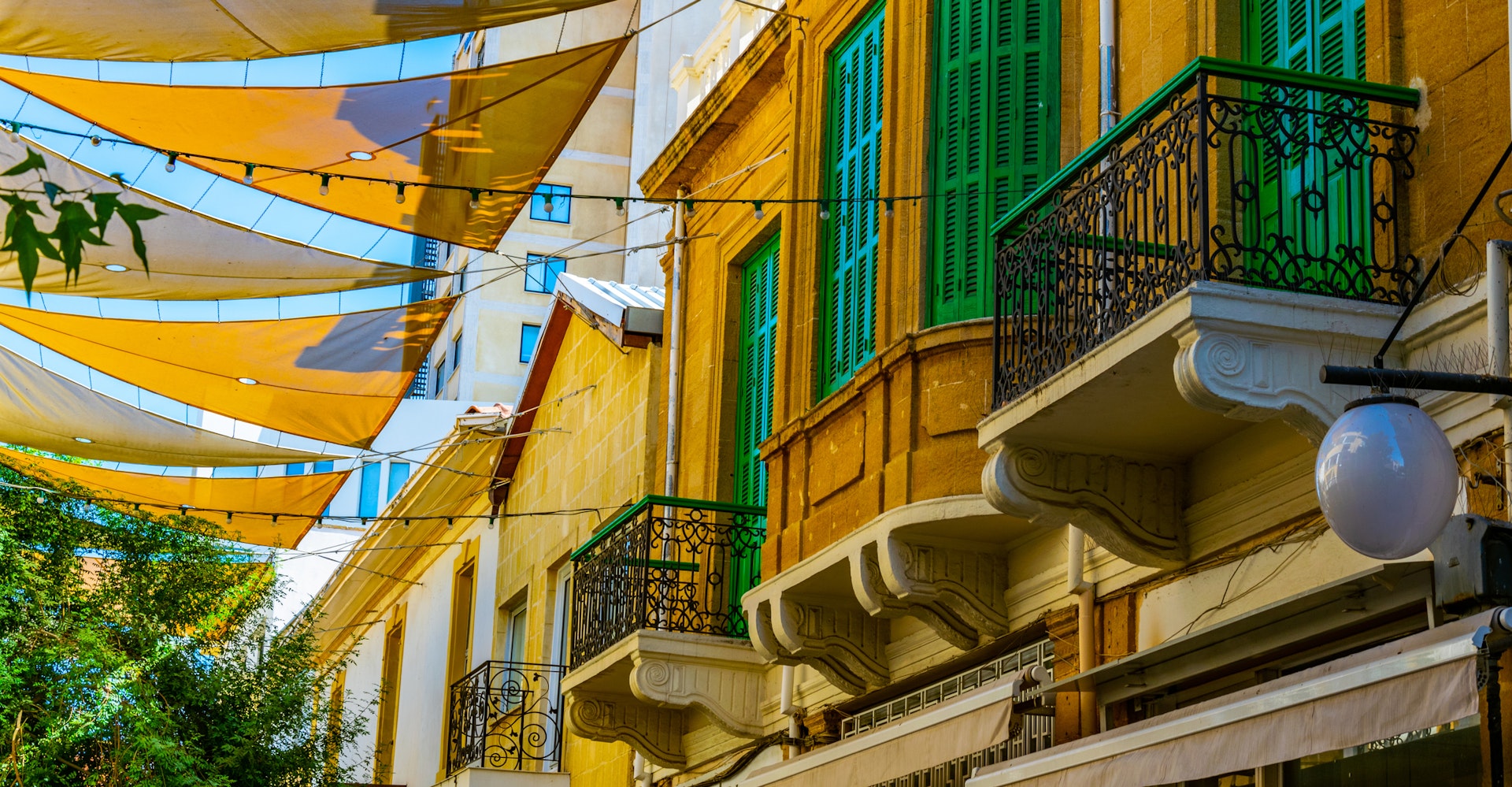 Colorful fabric is stretched across between the roofs of the main shopping avenue of Nicosia 