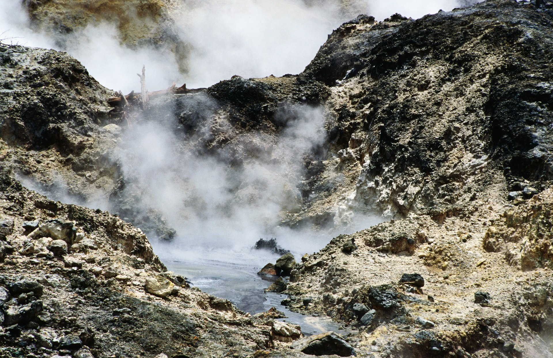 Steam rises from jagged rocks in Soufriere, St Lucia 