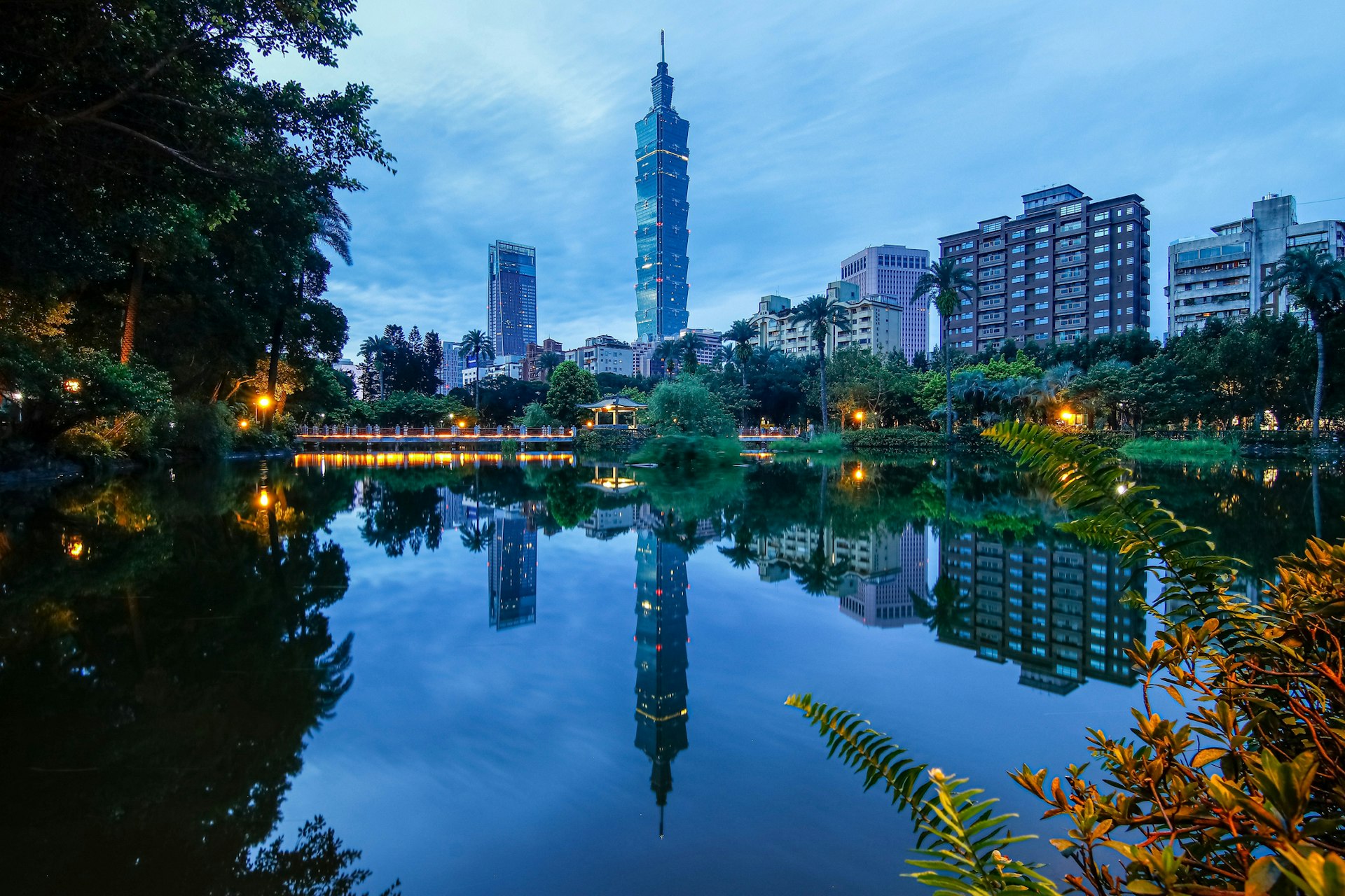 Reflection on water of Taipei 101 skyscraper and other buildings