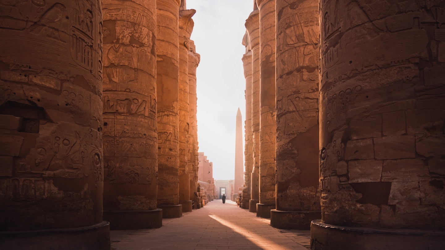 ancient corridor and columns of Karnak temple complex in Luxor city Egpyt during sunrise