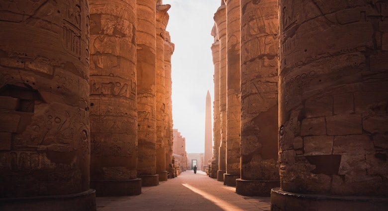 ancient corridor and columns of Karnak temple complex in Luxor city Egpyt during sunrise