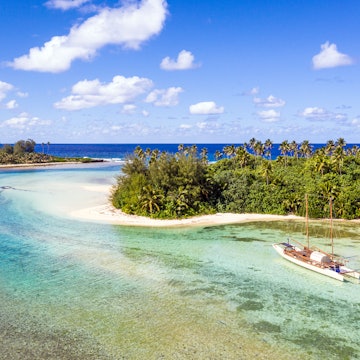 Sailboat in the idyllic Muri lagoon in rarotonga in the Cook islands in Polynesia south Pacific.