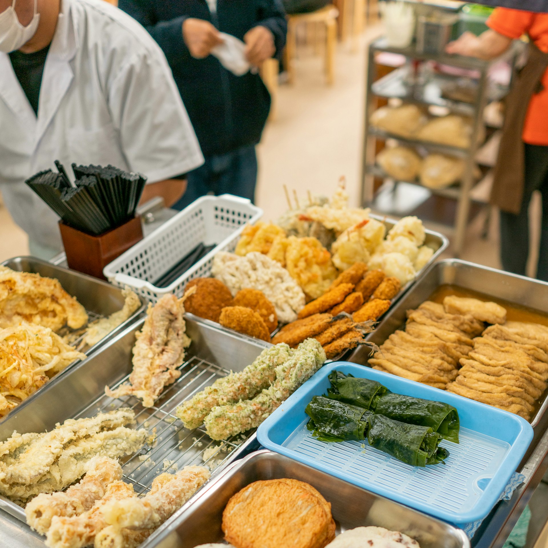 A selection of toppings and sides for udon, including freshly fried tempura