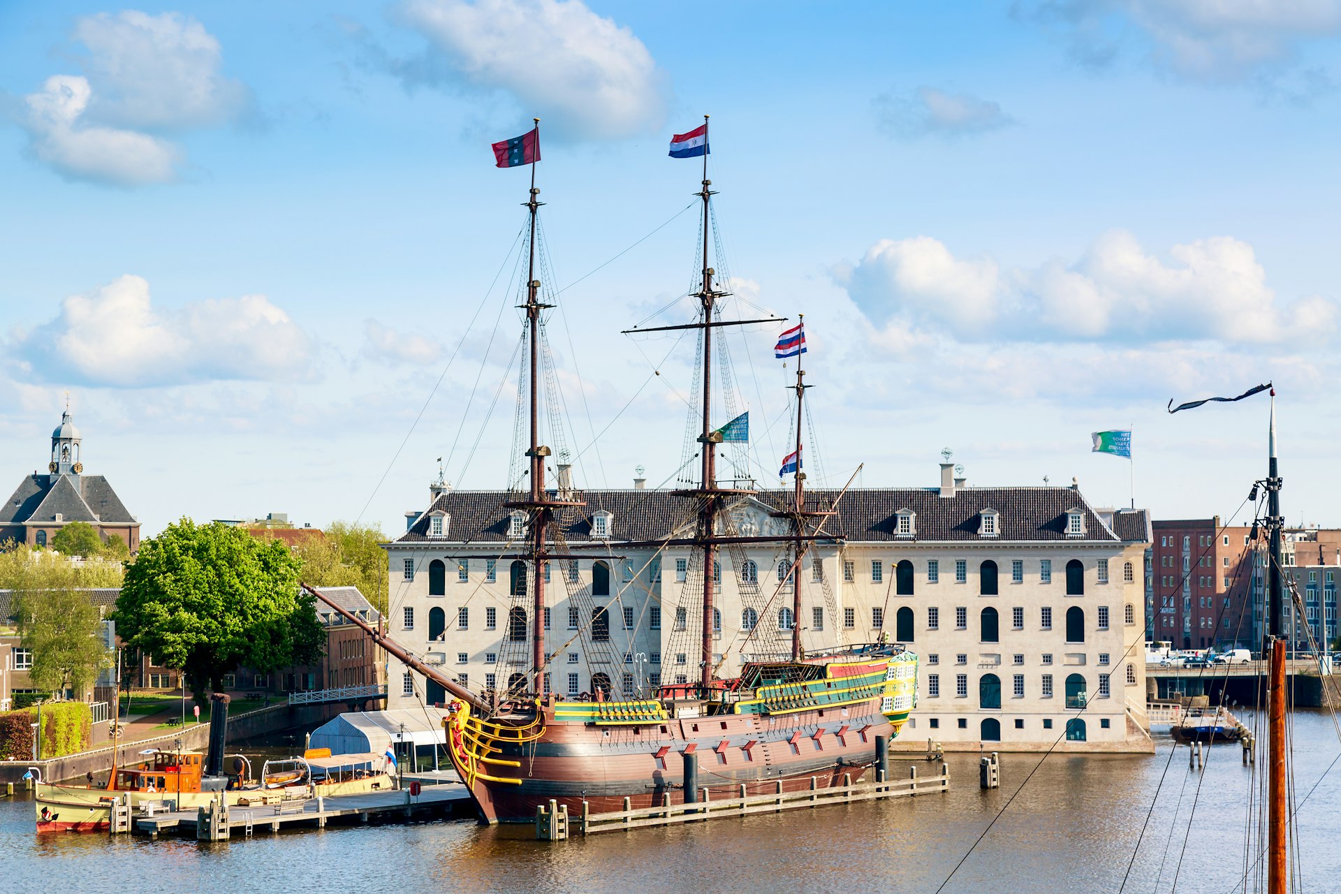 National Maritime Museum Scheepvaartmuseum in Amsterdam, featuring an old replica sailing ship.