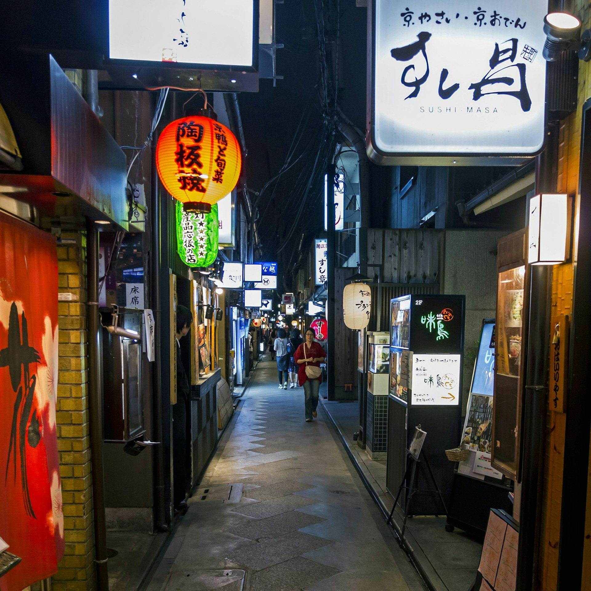Traditional paper lanterns line an alleyway in historic Ponto-chō, Kyoto