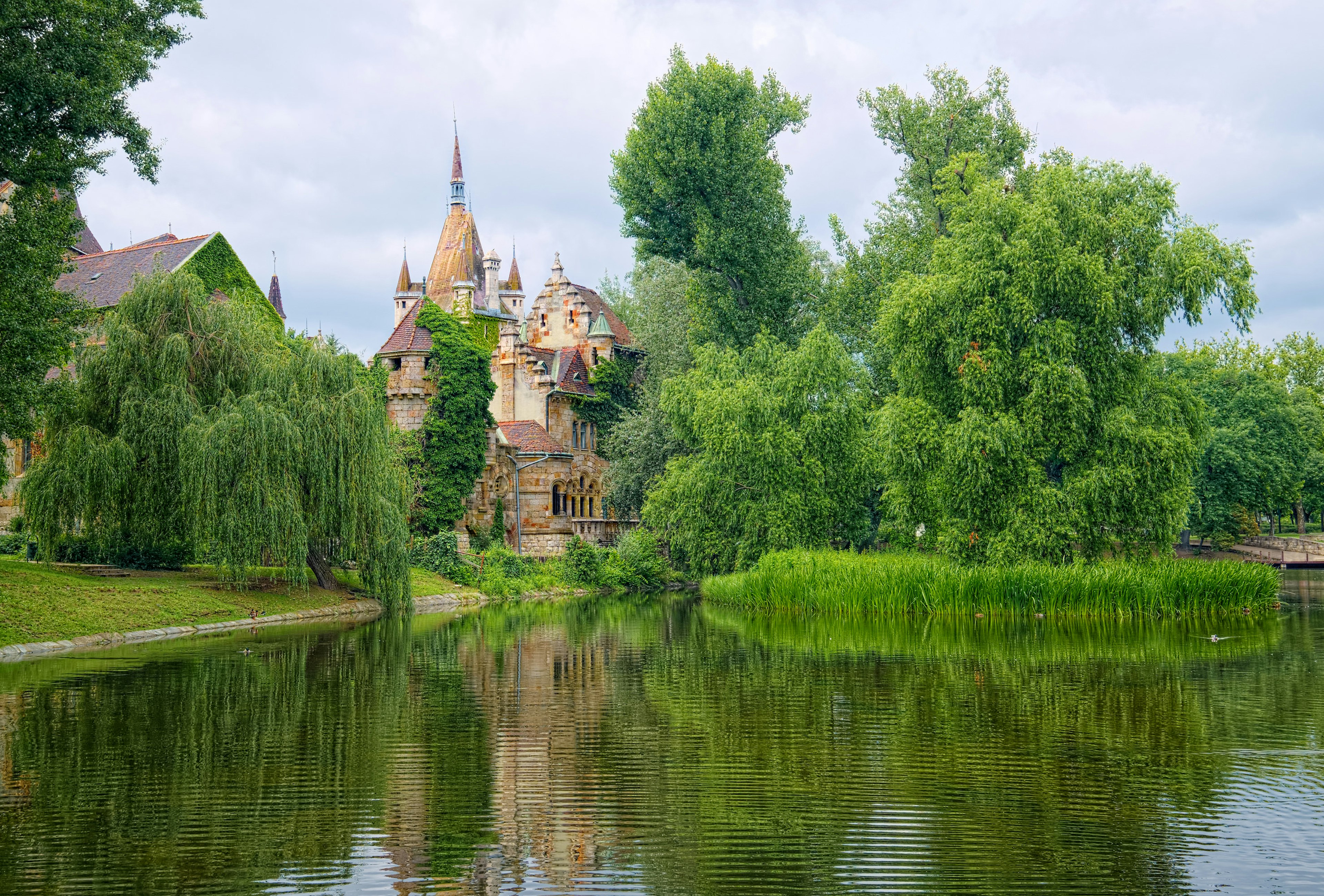 A lake in City Park in Budapest, Hungary, with Vajdahunyad Castle in the background