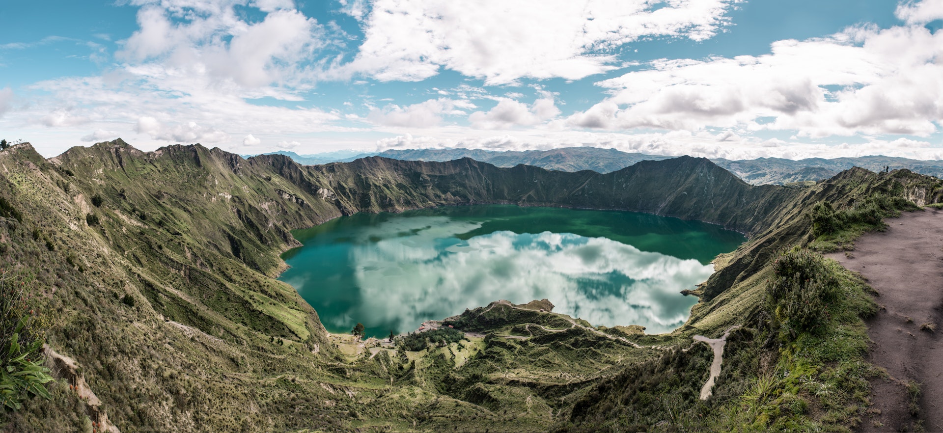 An aerial view of the blue-green lake in the Quilotoa crater