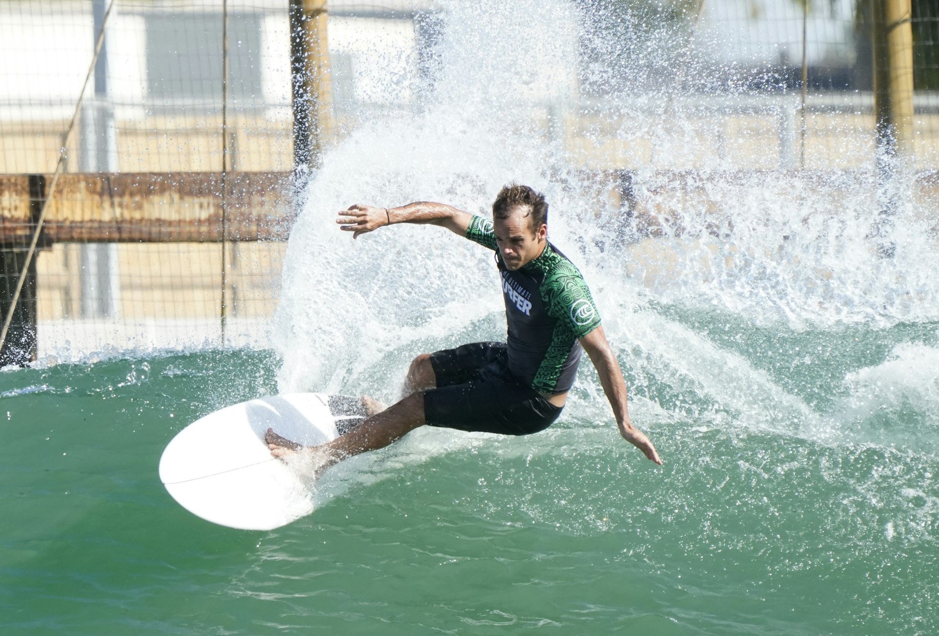 Puerto Rican surfer Alejandro Moreda rides a wave during a competition on ABC television show "Ultimate Surfer" 