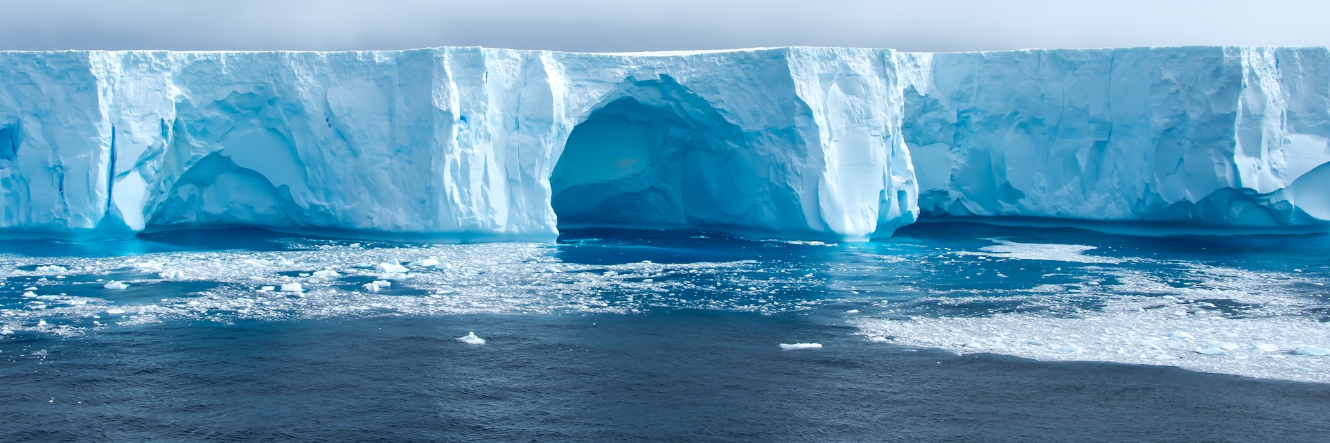 Beautiful blue iceberg and ice floe in Admiralty bay, King George Island Antarctica.